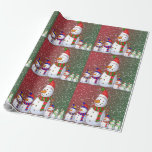 Papel De Regalo The Snowman Family -<br><div class="desc">This image is of a snowman family, all dressed in their colored winter hats and scarves. A carrot for their nose and colored buttons for their eyes and mouth. A green and red backround with snow confetti has been added. This design has been tiled throughout. This wrapping paper is available...</div>