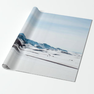 PAPEL DE REGALO TIERRA CUBIERTA DE NIEVE DURANTE EL DÍA