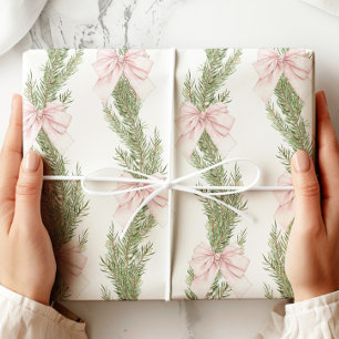 Papel de regalo verde de invierno con lazo rosa