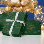 Papel De Regalo Vintage Merry Christmas Gold Stars Script Green<br><div class="desc">Envuelve tus regalos de vacaciones con este moderno papel de Navidades envueltos con estrellas doradas y "Feliz Navidad" escrito en oro sobre fondo verde. Tus regalos se verán extra alegres bajo el árbol de Navidad.</div>