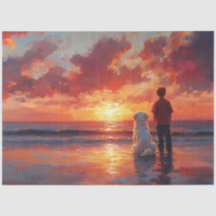 Perro y niño viendo la puesta de sol en la playa