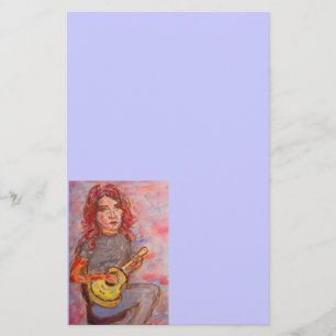 Papelería chica con el pelo y el ukulele rojos