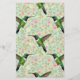 Papelería Colibríes sobre un fondo floral