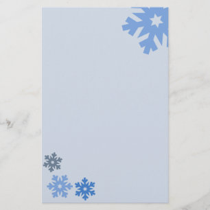 Papelería Copos de nieve azules en fondo rosado