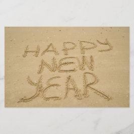 Papelería Feliz Año Nuevo en arena