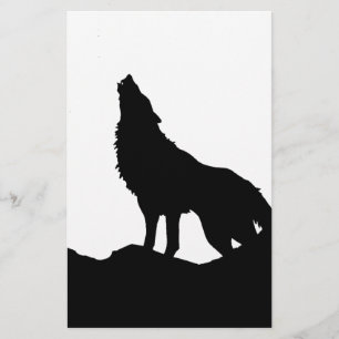 Papelería Lobo solitario parado en una colina