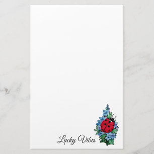 Papelería Mariquita linda de la acuarela con las flores