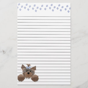 Papelería Perrito lanudo e impresiones azules de la pata