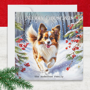 Papillon en nieve raza de perro linda Navidad invi