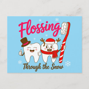 Pasando hilo dental a través de la Navidad Diente