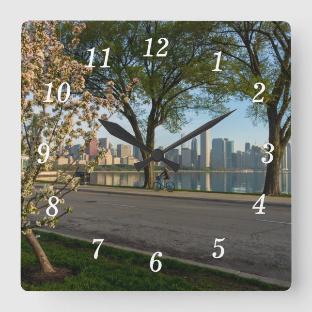 Paseo en bicicleta por el reloj de pared solidario (Anverso)