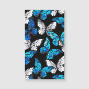 Patrón continuo oscuro con mariposas azules Morpho