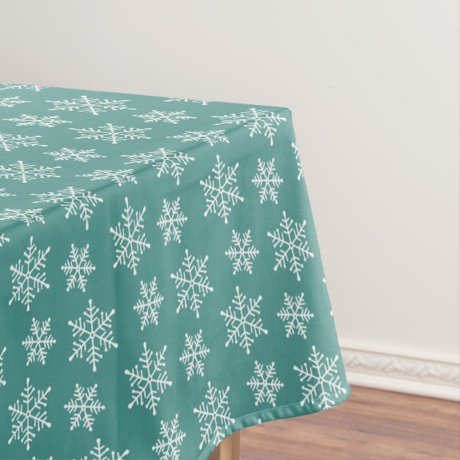 Patrón de copo de nieve blanco en mantel azul verd (In Situ)