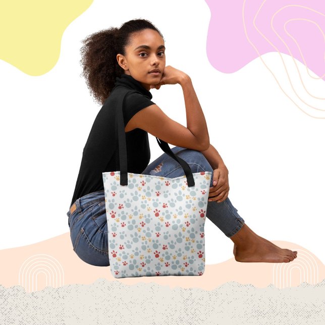 Patrón de impresión de la hoja arcoiris con bolsa (Fun and whimsical paw print pattern tote bag design.)