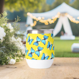 Patrón de mariposas azules en amarillo