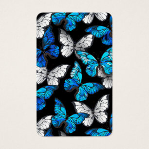 Patrón oscuro sin costuras con mariposas azules Mo