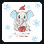 Pegatina Cuadrada Baby Boy First Christmas Cute Elephant Holidays<br><div class="desc">Un adorable elefante de bebé con un gorra de Navidades,  un regalo de Navidades,  sosteniendo un dulce de caña de Navidades y un fondo nevado con hermosos copos de nieve. Niño: Primeras vacaciones de Navidad. Personalice cambiando el nombre.</div>