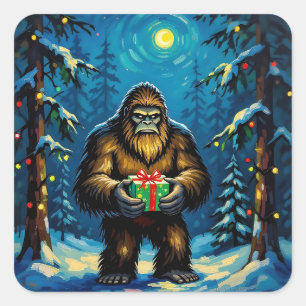 Pegatina Cuadrada Bigfoot divertido sosteniendo un regalo de Navidad