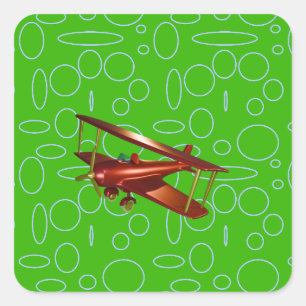 Pegatina Cuadrada Bioavión rojo en círculos verdes y bucles