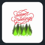 Pegatina Cuadrada christmas seasons greetings labels<br><div class="desc">The greetings will be appreciated and the artwork of lighted everygreen trees bring festivity to the occasion. Anyone could do with this cheerful label on a product  or gift they receive as customer,  friend,  family boss and more.</div>