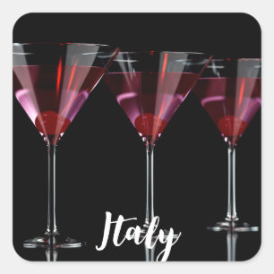 Pegatina Cuadrada Cócteles rojos en vidrio martini con cereza
