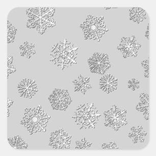 Pegatina Cuadrada Copos de nieve 3D plateados sobre un fondo platead