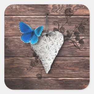 Pegatina Cuadrada Corazón de campo y mariposa en la madera