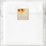 Pegatina Cuadrada Flores de color de agua en un pergamino con sombra<br><div class="desc">Estos stickers románticos de boda presentan un diseño floral vintage. El fondo es un diseño rústico de papel pergamino descolorido,  acentuado con girasoles acuáticos dorados. En la parte superior izquierda se ve un delicado ramo silvestre,  con los nombres de la pareja y la fecha boda impresos a continuación.</div>