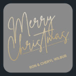 Pegatina Cuadrada Gold Merry Christmas Luxe Gray<br><div class="desc">Feliz Navidad con un falso guión de Relieve metalizado dorado y tus nombres con letras de moda,  estos pegatinas grises son elegantes para cualquier ocasión de vacaciones de Navidades. MÁS COLORES y productos a juego en nuestra colección.</div>