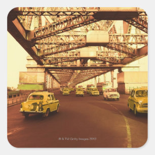 Pegatina Cuadrada Los taxis en un puente