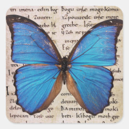 Pegatina Cuadrada Mariposa morfo azul en la página de libros Pegatin