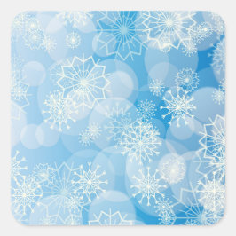 Pegatina Cuadrada Navidades con copos de nieve en un fondo azul