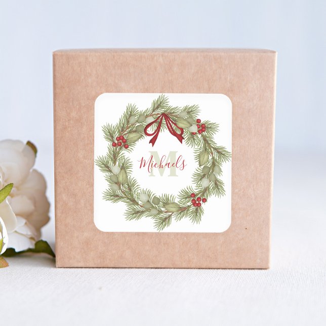 Pegatina Cuadrada Navidades Elegante Monograma Wreath Red Holly (Christmas holiday greenery and red holly berries wreath with red ribbon sticker. )