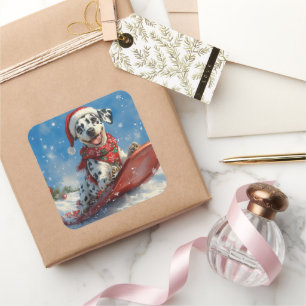 Pegatina Cuadrada Perro dálmata en trineo Deja que nieve Navidad