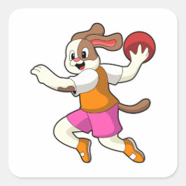 Pegatina Cuadrada Perro en jugador de balonmano con balonmano