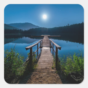Pegatina Cuadrada Pier de noche bajo una luna llena