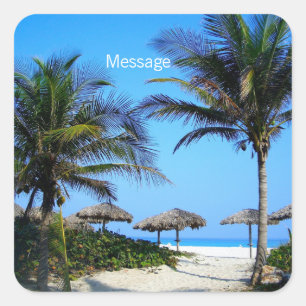 Pegatina Cuadrada Playa de arena con palmeras y vista al océano oval