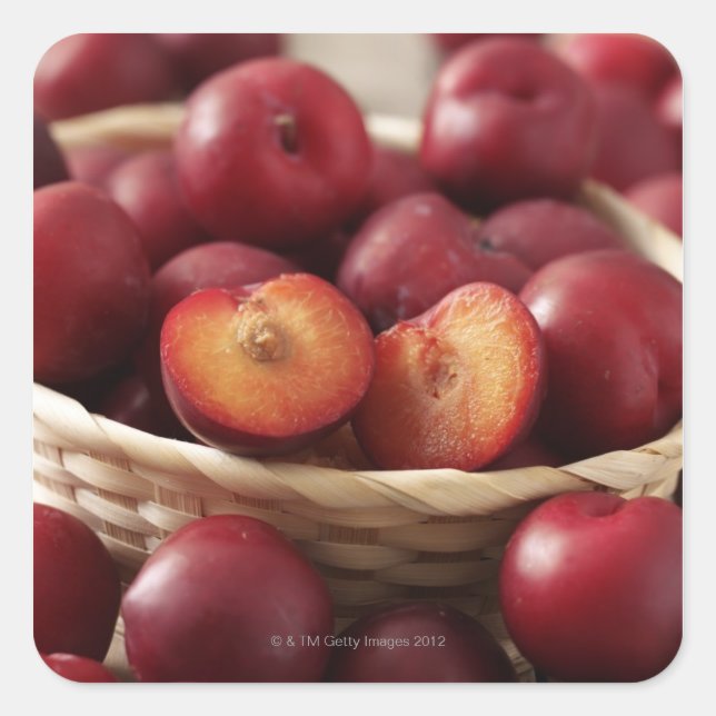 Pegatina Cuadrada Plumas en canasta (Anverso)