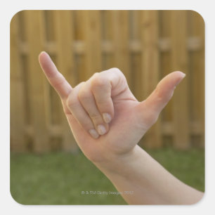 Pegatina Cuadrada Primer de la mano de una mujer que hace una