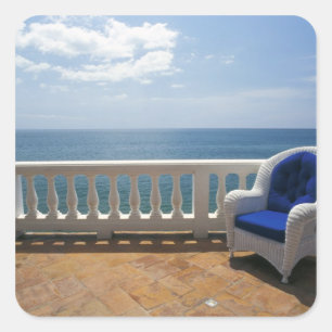 Pegatina Cuadrada Puerto Rico. Sillón de mimbre y terraza con baldo