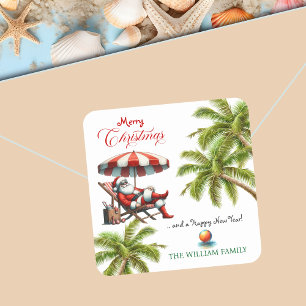 Pegatina Cuadrada Santa bajo una sombrilla de playa Navidad