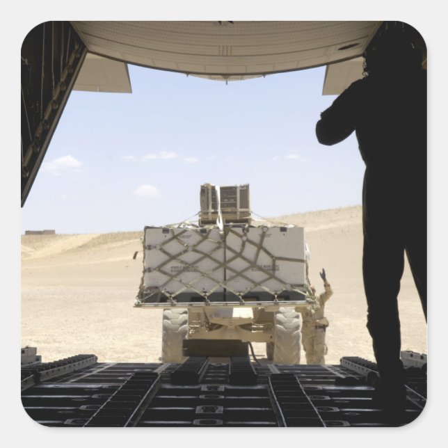 Pegatina Cuadrada Un elevador de horquilla carga la carga sobre un h (Anverso)