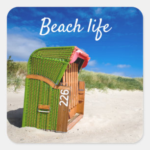 Pegatina Cuadrada Vida de la playa Foto de una silla de playa verde 