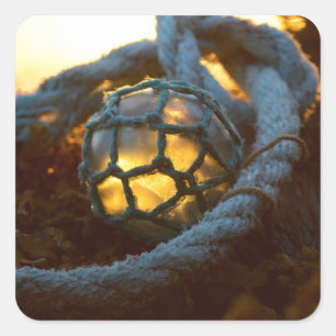 Pegatina Cuadrada Vidrio flotante resplandeciente al atardecer, Alas