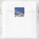 Pegatina Cuadrada Vintage Christmas, Santa Flying Sleigh w Reindeer<br><div class="desc">Ilustracion de la Vintage. Imagen de feriado navideño con un alegre Santa Claus con su reno. Están volando su trineo lleno de juguetes a través del cielo azul y sobre un pueblo dormido cubierto de nieve en invierno en la víspera de los Navidades. Ho, ho, ho Happy Holidays and Season's...</div>