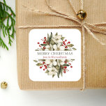 Pegatina Cuadrada Watercolor Merry Christmas Floral Magnolia Berries<br><div class="desc">Este pegatina de vacaciones personalizado cuenta con un ramo acuático de flores de magnolia blanca,  vegetación y bayas rojas. En el medio,  las palabras "Feliz Navidad" aparecen en el fondo blanco de la letra del serif verde oliva. Personalice el diseño con su apellido en cursiva roja oscura.</div>