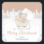 Pegatina Cuadrada Winter Bear Brown Sleigh Merry Christmas<br><div class="desc">Este lindo y divertido pegatina puede ser personalizado con un nombre, relación o título. Cuenta con un oso adorable en un trineo marrón rodeado de nieve, montañas y pinos. El texto combina guiones manuscritos y sans serif para un estilo elegante y moderno. Los bonitos arreglos florales purpurinas y los confitis...</div>
