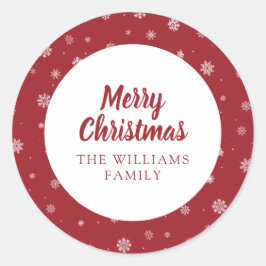 Pegatina de vacaciones rojas con copos de nieve