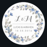 Pegatina del Favor de la Boda Vintage Blue Flower<br><div class="desc">Boda de la corona floral vintage y rústica gracias pegatina. Decorado con acuarela de flores, hojas y bayas. Pegatina de monograma para sellos para sobres de invitados a la boda. Personalizar la redacción para cualquier ocasión especial. Favor nupcial de primavera, etiqueta de regalo de la ducha de novia, fiesta de...</div>
