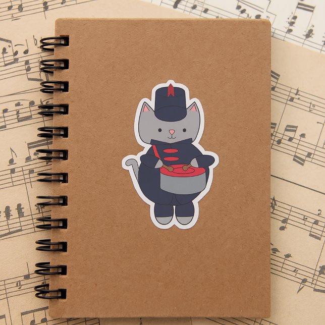 Pegatina Drummer Marching Band Cat Navy Blue and Red (A sticker of a gray cat playing the snare drum in a red & navy blue marching band uniform.)